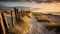 Serene Beachscape: Stone Fence And Dunes At Sunrise