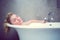 Serene blonde lying in the bath