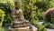 Serene Buddha Statue in Peaceful Garden Setting.