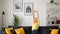 Serene carefree middle-aged woman with long hair sitting on sofa in modern apartment