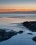 Serene coastal landscape at sunset