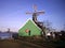 Serene countryside scene with a gracefully turning windmill