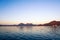 Serene dawn shot of lake with mountains in the distance