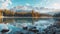 Serene early autumn morning at high tatra lake mountain glow, pine trees, and sky reflections