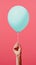 Serene Elegance: One Turquoise Balloon Soars Against a Striking Coral Backdrop. Generative AI