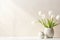 Serene and elegant close up of white tulips on a white table, bathed in soft and gentle light tones