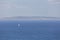 serene Greek island scene: blue sky, sea, and horizon