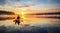Serene kayaking at sunrise, paddler enjoying the calm water and misty horizon, a moment of tranquility.