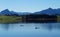 serene lake Bannwaldsee in Schwangau with Bavarian Alps in background on sunny November day (Allgaeu, Bavaria, Germany)