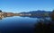 serene lake Bannwaldsee in Schwangau with Bavarian Alps in background on sunny November day (Allgaeu, Bavaria, Germany)