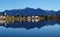 serene lake Bannwaldsee in Schwangau with Bavarian Alps in background on sunny November day (Allgaeu, Bavaria, Germany)