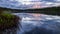 Serene lake reflection with purple sky