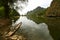 Serene lake scenery with a wooden fisherman\'s boat