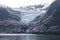 Serene lake at Svartisen Glacier\\\'s base mirrors the twilight in Arctic wilderness\\\'s embrace