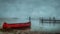 Serene lake view with red canoe on a misty day. quiet and peaceful scenery. simple and elegant outdoor style. nature