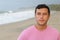 Serene man walking at the beach