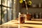 Serene morning moment with glass jar full of ground coffee placed on sunlit kitchen windowsill. Soft light illuminates rich brown