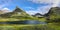 Serene mountain lake among the jagged stone peaks