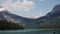 Serene Mountain Lake Landscape with Pine Forest and Snow Peaks