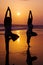 Serene People In The Beach Doing Yoga In The Sunset