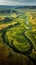 Serene River Flowing Through Vibrant Green Countryside Field