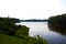 Serene river surrounded by lush green trees