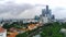 A serene river winds through a bustling cityscape, its waters reflecting the towering skyscrapers in Surabaya, Indonesia