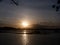 Serene, romantic and beautiful golden sunset over lake fishing farm at dawn.