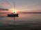 Serene Sailboat at Anchor at Sunset