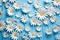 Serene Sea of Daisies: Fondant Florals Adrift on a Calming Azure Canvas. Generative AI