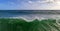 Serene sea panorama with big green wave in the foreground, tsunami