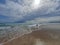 Serene seaside landscape with sky with clouds and waves