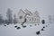 Serene shot of Totenviken church and a cemetery in front blanketed in snow