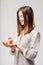 Serene smiling woman with a gift in her hands