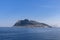 A serene summer tableau captured from a ferry traveling to Lofoten Island, illustrating a solitary