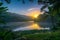 Serene Sunrise Over Tranquil Forest Lake