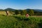 Serene Sunset Harvest: Farmer and Woman Tending to Nature\'s Bounty