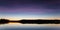 Serene view of calm lake at twilight