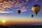 Serene view of a group of hot air balloons soaring above