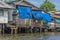 A serene warren of canals, floating houses and stilt houses over the Chao Phraya River, at Krung Thon Bridge Saphan Sang Hi