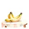 serene watercolor scene where ripe bananas bask in the gentle sunlight on a rustic table.