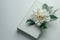 Serene White Flower on Hardcover Book - Minimalist Composition