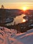 Serene winter sunset over a tranquil river. Winter landscape