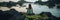 Serene woman practicing yoga on the sandy seashore while admiring the breathtaking view