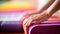 Serene young woman gracefully rolling up a vibrant and colorful yoga mat at her cozy home
