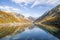 the serenity of Baserca Reservoir in Spain, nestled amidst the valleys and peaks of the surrounding autumn landscape, Spain