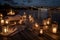 serenity deck with chaise lounges, candles, and lanterns for a romantic evening