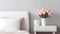 Serenity by Design: Soft Pink Roses on Tranquil White Nightstand