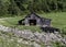 Serenity in a rural area with a wooden barn.