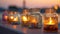 Serenity by the Sea: Closeup Macro of Candles in Ornate Glass Jars at Sunset